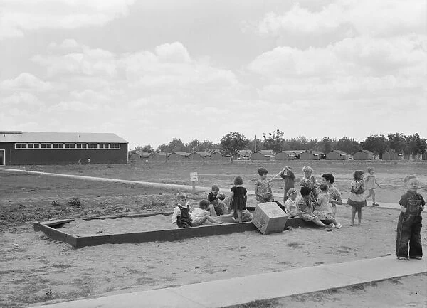 Nursery school children with their teacher, FSA camp, Tulare County, California, 1939. Creator: Dorothea Lange